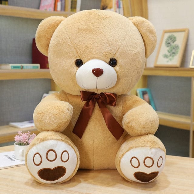 Petit ours en peluche marron
